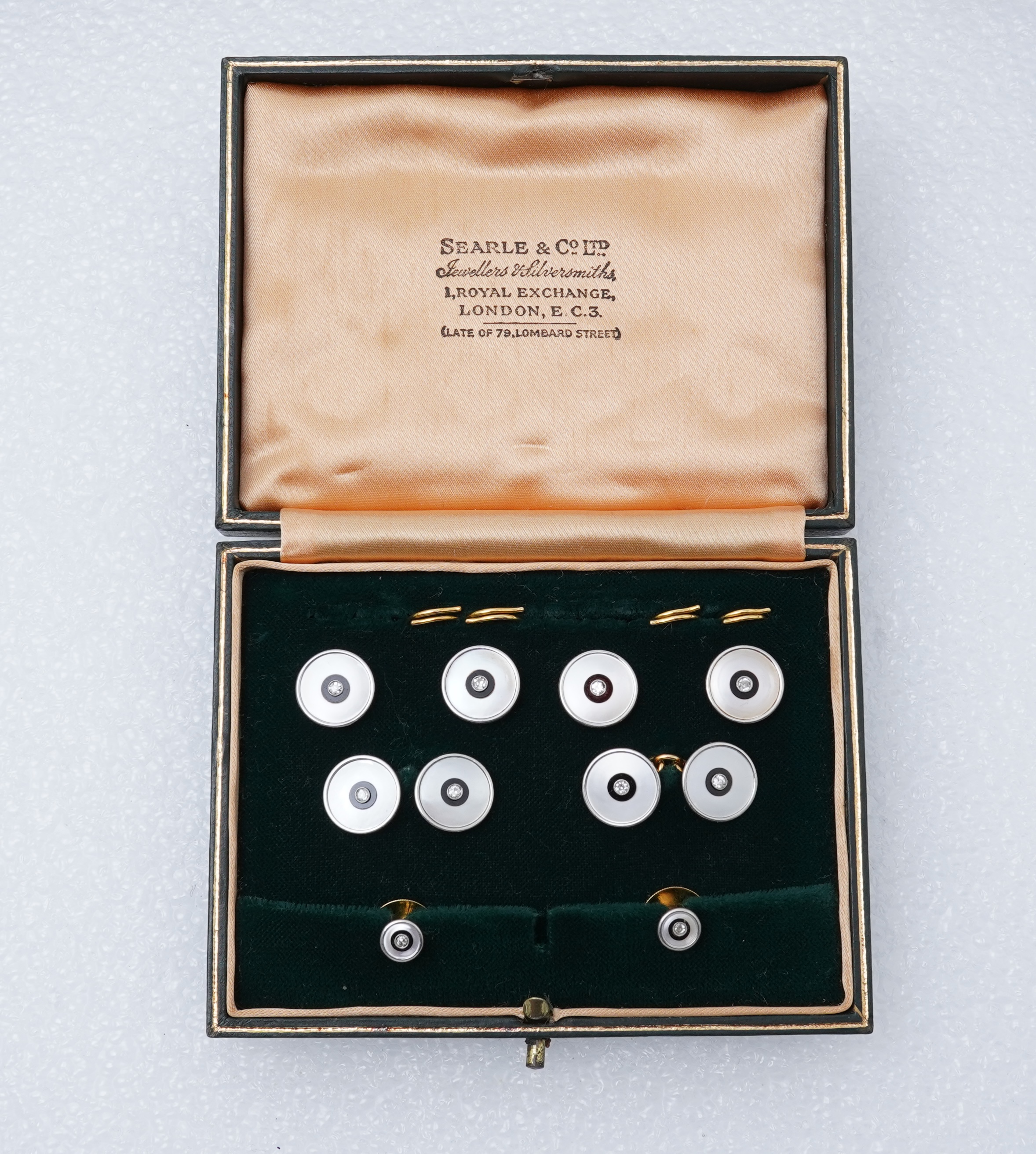 An Art Deco mother of pearl, onyx and diamond dress set, early 20th century